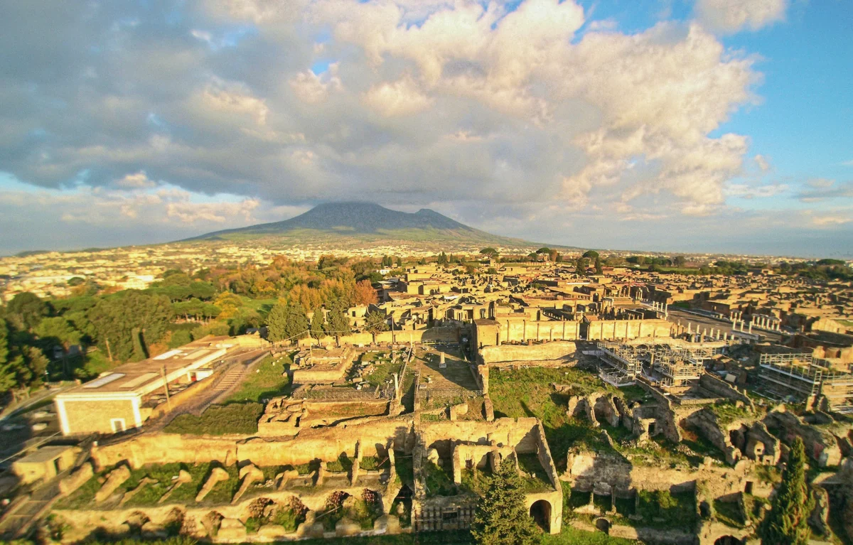 The ruins of Pompeii with Vesuvius behind - shoulder-season visibility at its best for private tours