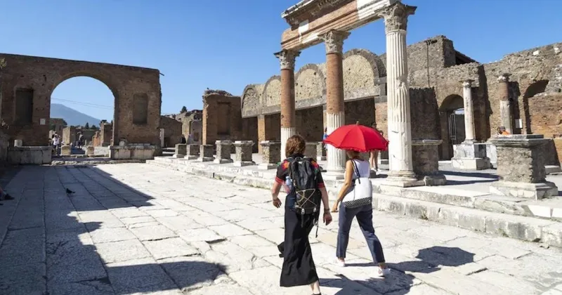 Private guide beside the Large Theatre ruins in Pompeii on a personalized accessible tour