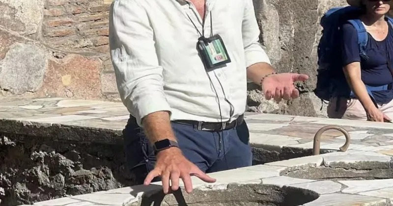 Local guide showing a private group the mosaic floors of a Pompeii house on an exclusive customized tour